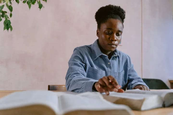 Members in a class with their Bibles open