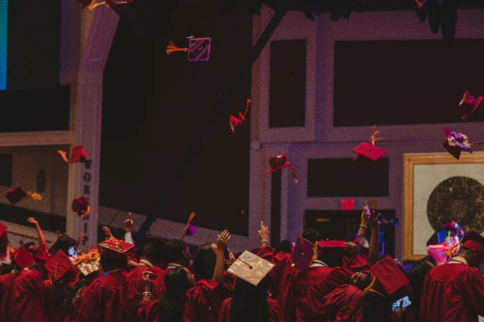 Instructor handing a graduate their certificate